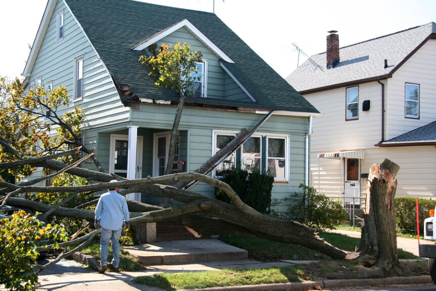Damaged house from tree collapse due to storm