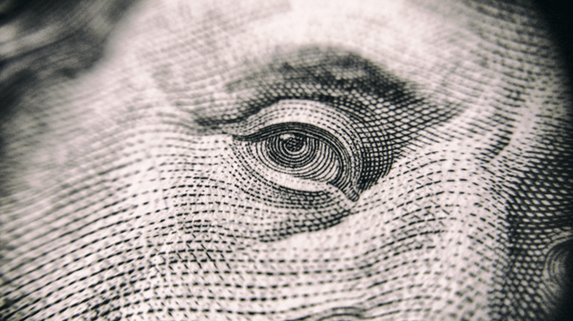 Closeup of Benjamin Franklin on $100 bill no win no fee lawyer